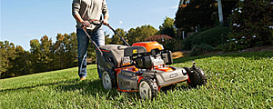 Man mowing lawn with a lawn mower